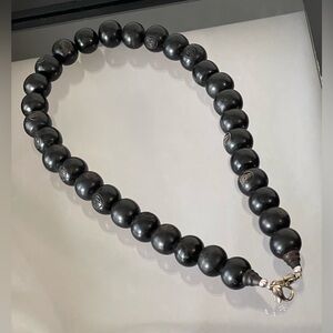 Sandalwood beads with Buddha on them